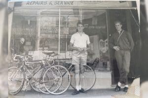 Kevin Thompson from KWT Imports outside his first bicycle shop in Redfern, an inner suburb of Sydney, during the 1950's.