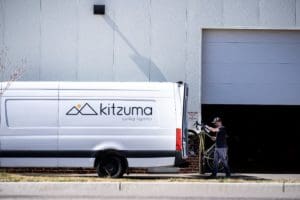 Kitzuma has a unique rack system within its vans to pick up bikes from participating retailers and deliver the complete bike to consumers, without the need for boxes.