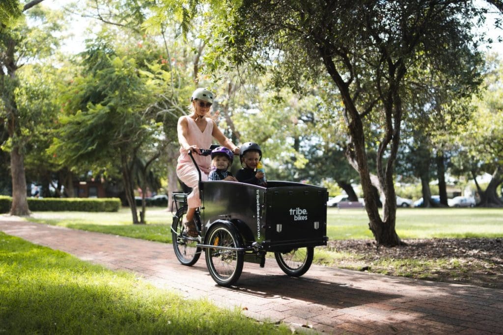 Three-wheelers were the clear preference when Nick, Steve and their families initially trialled different cargo bike styles. Having the kids up front made for more interesting journeys and three wheels offered greater stability at low speeds.