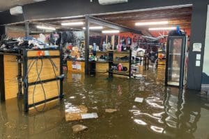 Flood waters inundate the Epic Cycles store in Paddington.
