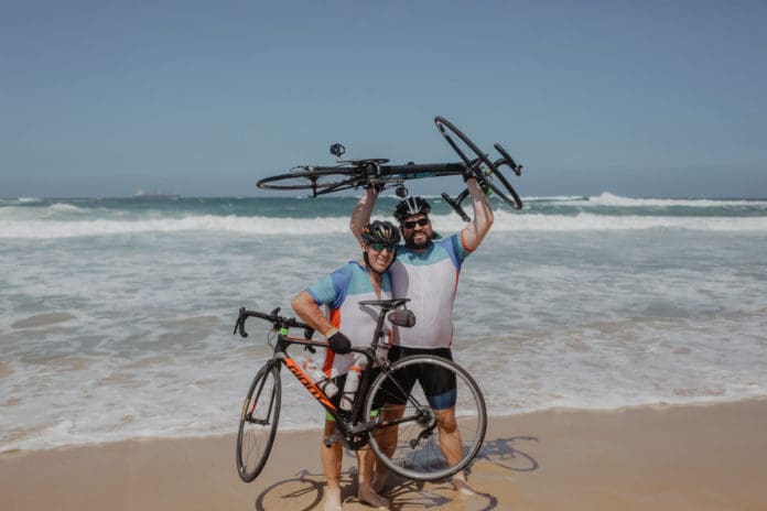 Compassion Australia riders holding bikes