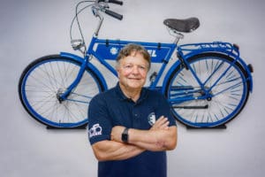 Erhard Büchel standing with bike