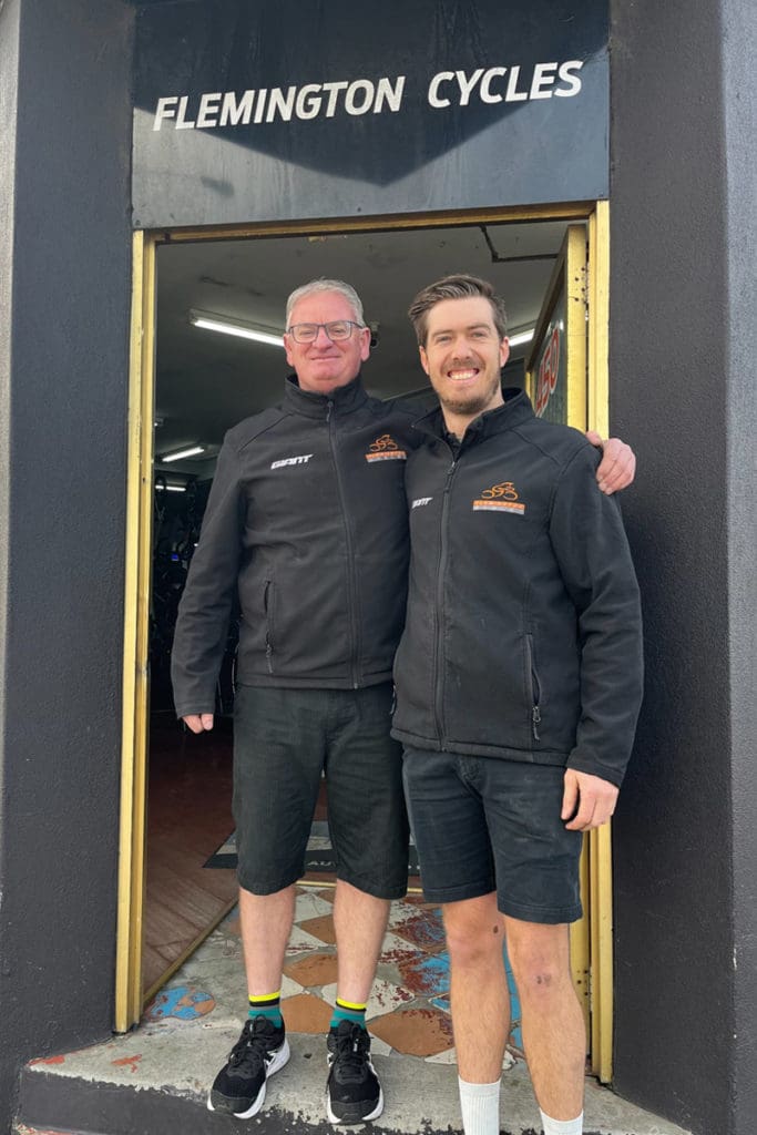 Damien Lack and staff member at the front of Flemington Cycles