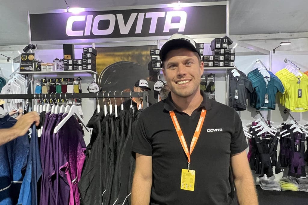 Man standing infront of cycling apparel stall