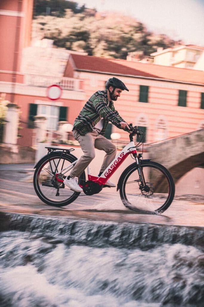 person riding e-bike in city scape