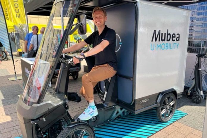Person sitting on e-cargo bike