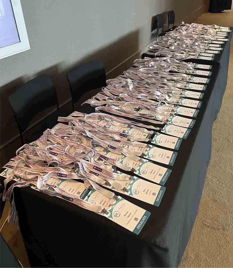 table of Micromobility Conference lanyards, delegate badges