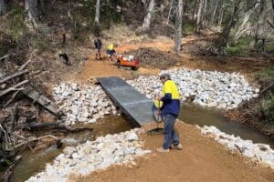 People constructing MTB trail in bushland