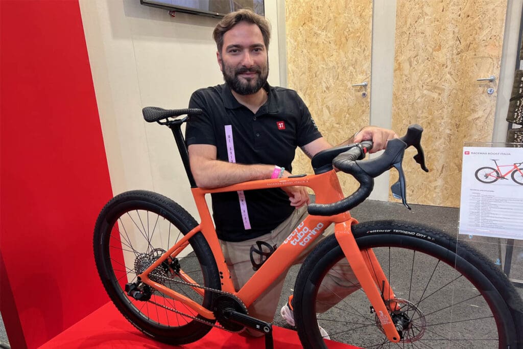 Man posing with bike at bicycle expo