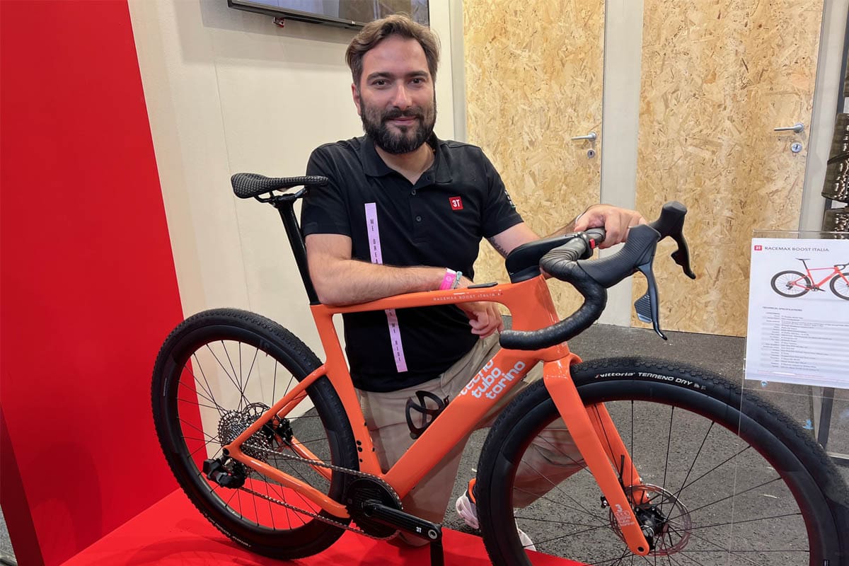 Man posing with bike at bicycle expo