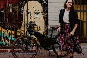 Woman standing with Tiller ebike