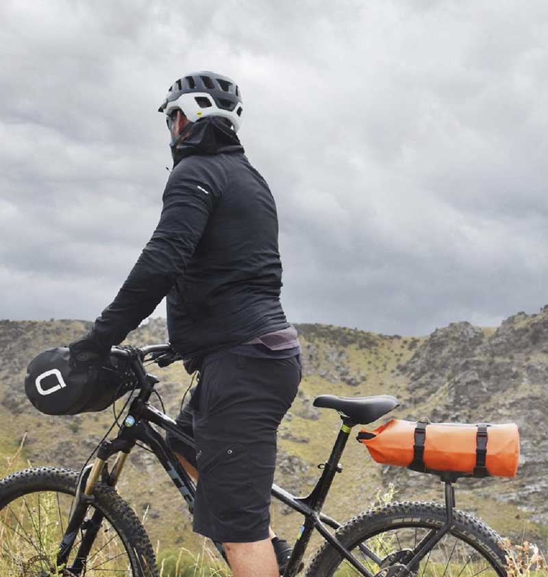 Person on bike with mountain background