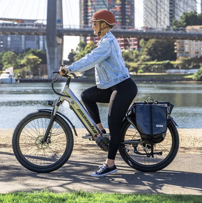 Woman in helmet riding an e-bike
