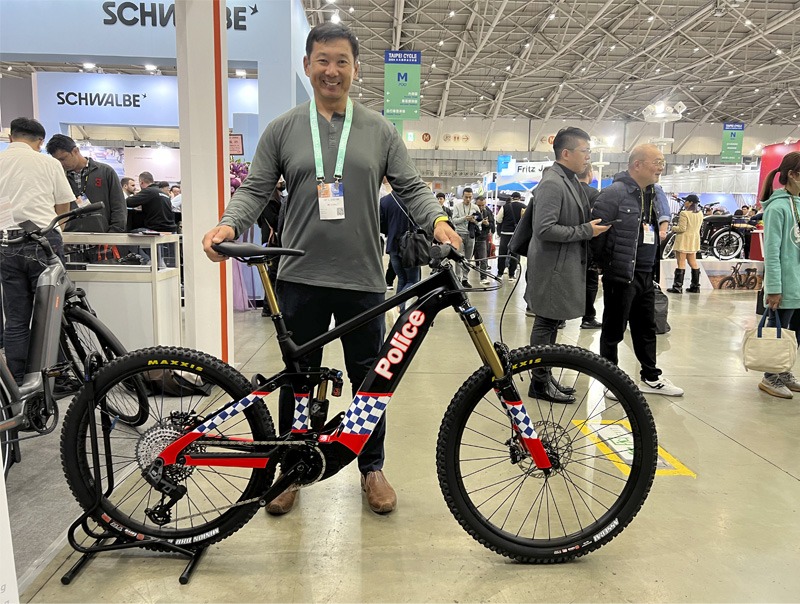 Man with bicycle on display at expo