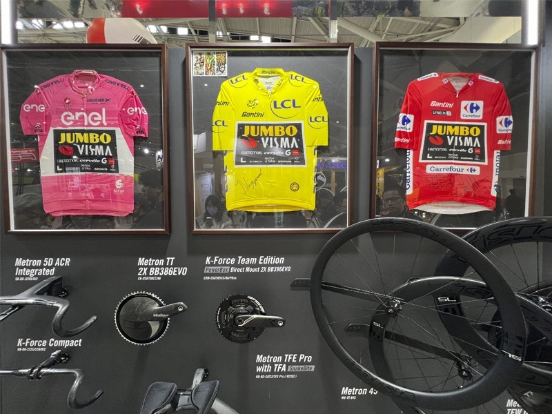 Bike expo display with framed winning jerseys