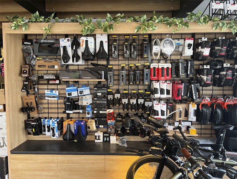 Interior view of bicycle shop with products display on wall