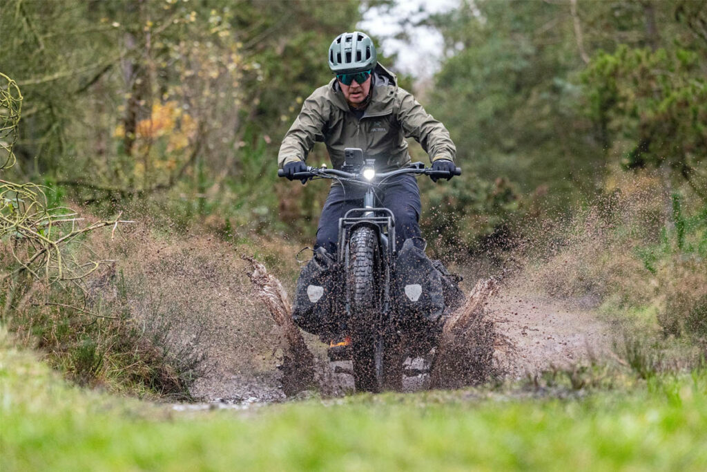 Person riding adventure e-cargo bike