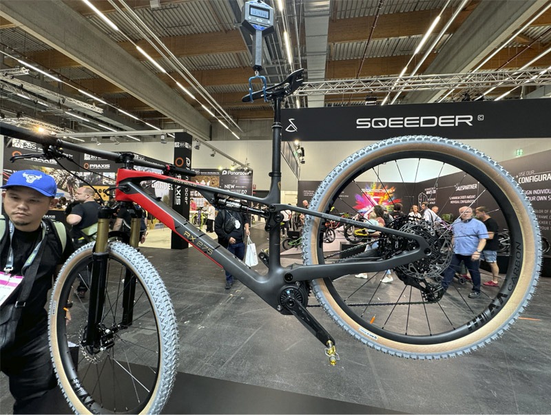 Bicycle on display at expo hanging from scales