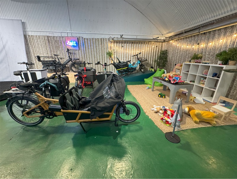 Kids play area with cargo bicycles in a store