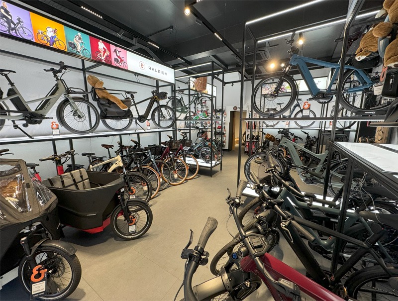 Interior view of bicycle shop with bikes on display.