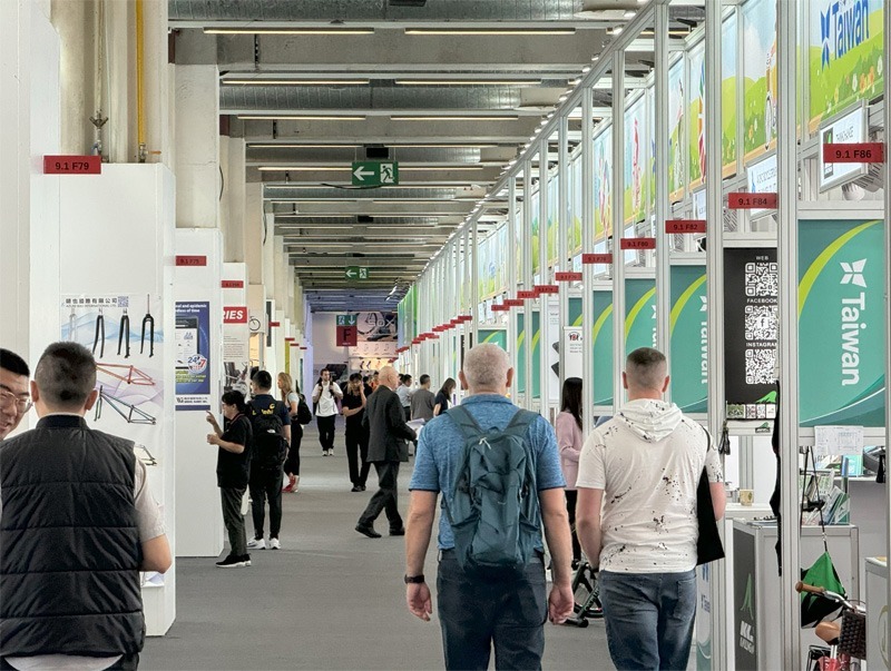 Row of small booths at bicycle expo.