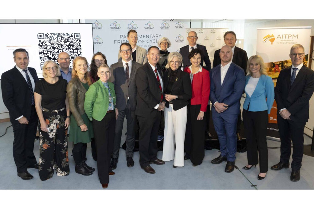 Advocates and Politicians posing in a group photo at official event.