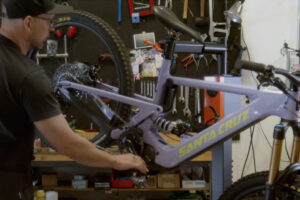 Person working on bike in a workshop