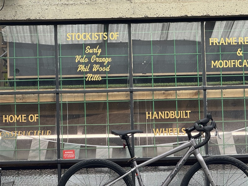 Hand lettering on a bicycle shop window