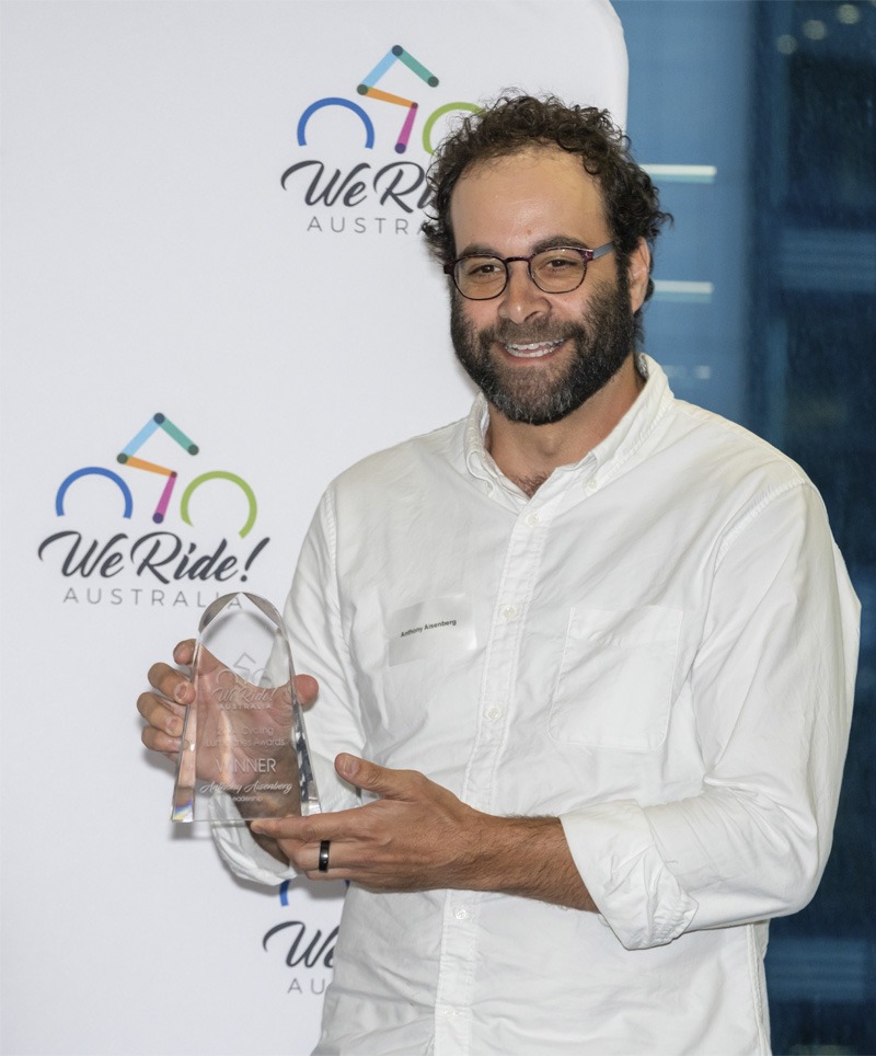 A man holding an award