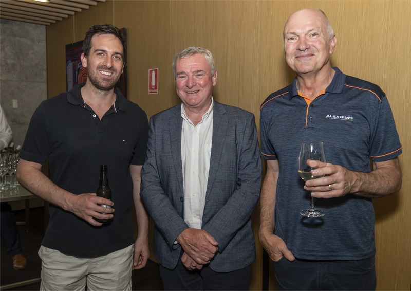 Portrait of three men wearing professional attire.