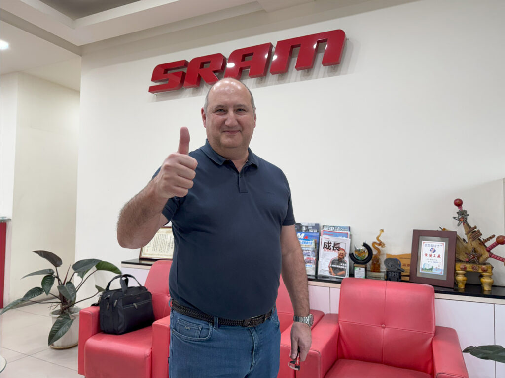 Man doing thumbs up with one hand.