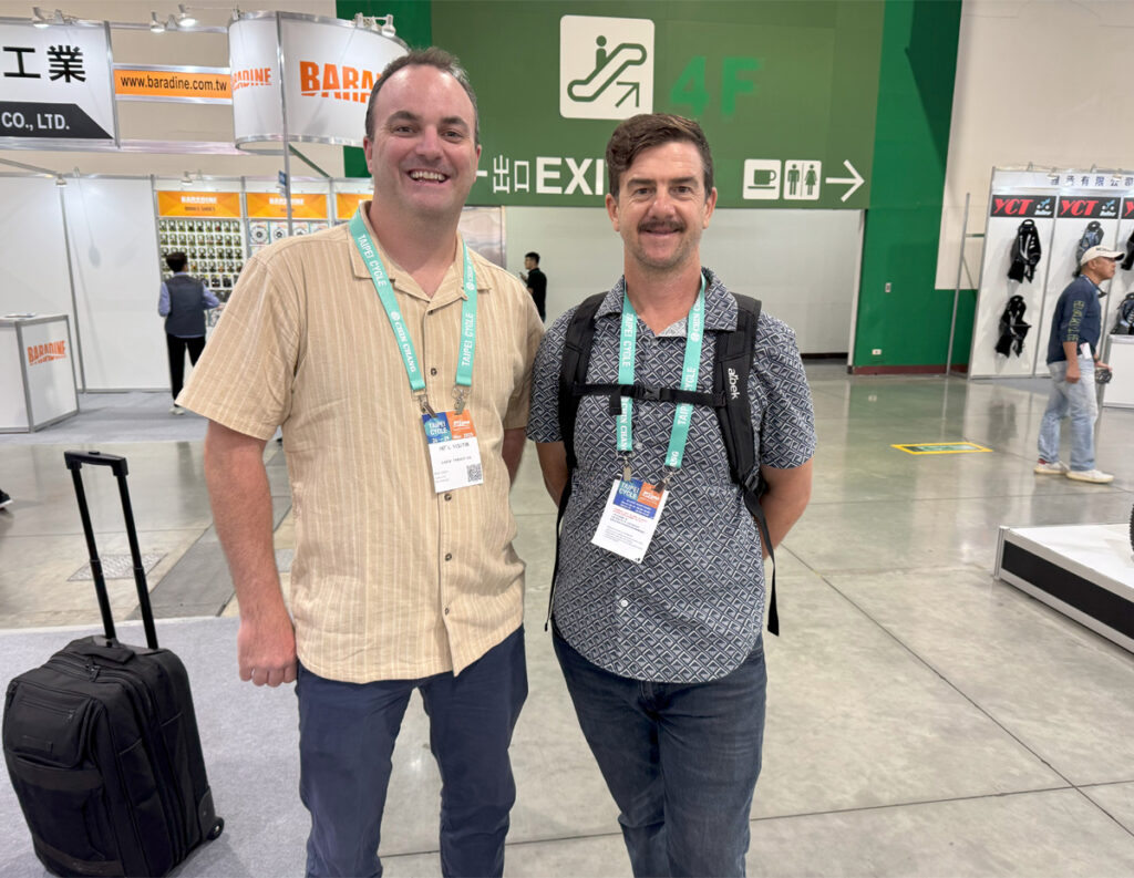 Two men wearing expo badges